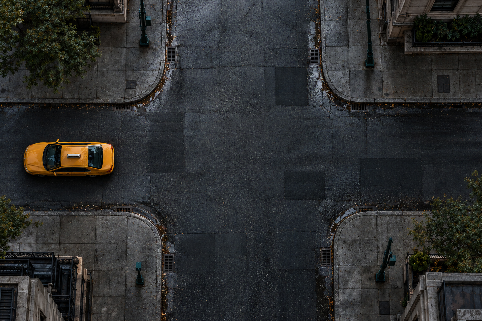 A bird’s-eye view of a New York intersection, with a yellow taxi on the roadway. The interactive scene is unavailable.